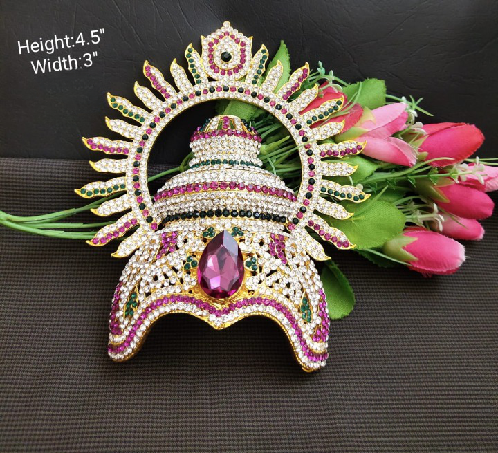 A radiant mukut crown specially crafted for adorning a Hindu god idol, enhancing their divine appearance and aura.