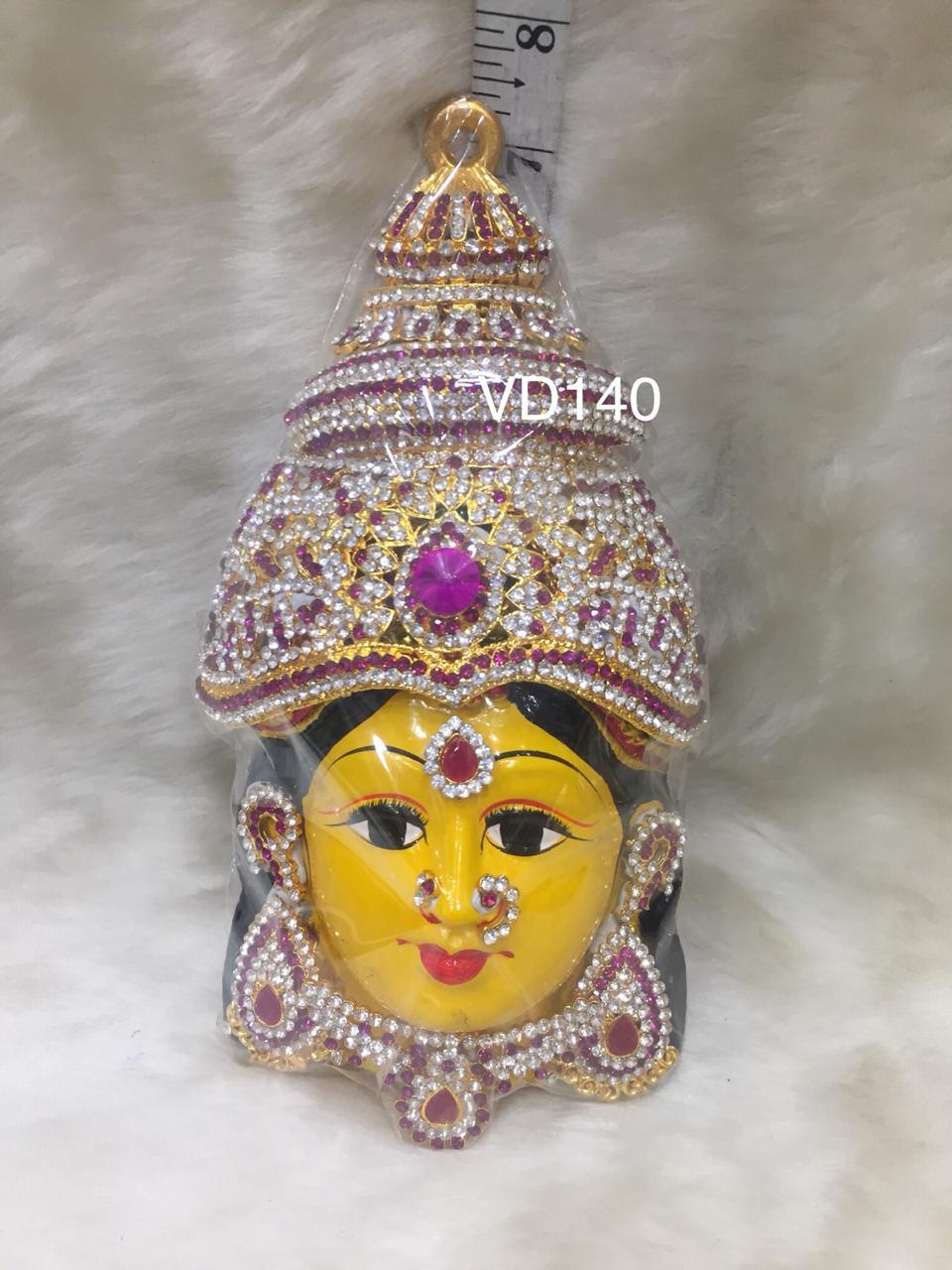 Graceful face of Varalakshmi adorned with a majestic golden crown, embodying her divine status as the bestower of wealth and prosperity.